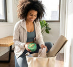 Lifestyle shot of Nimba Foods Whipped Shea Butter on a wooden surface