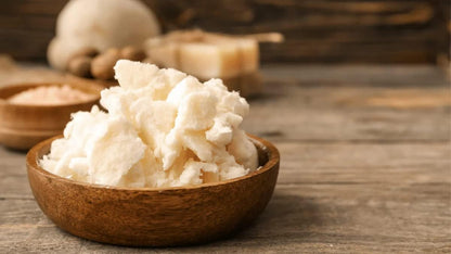Organic cocoa butter being applied to dry skin