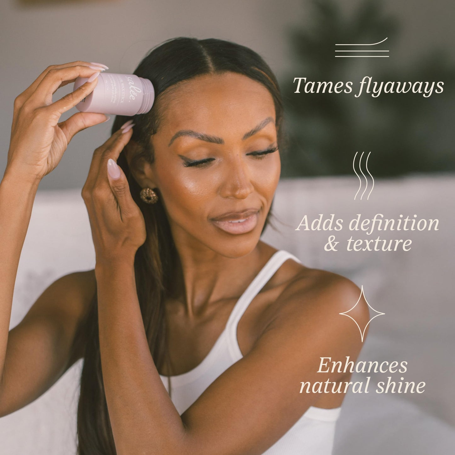 Side profile of sleek bun hairstyle using Salée Hair Wax