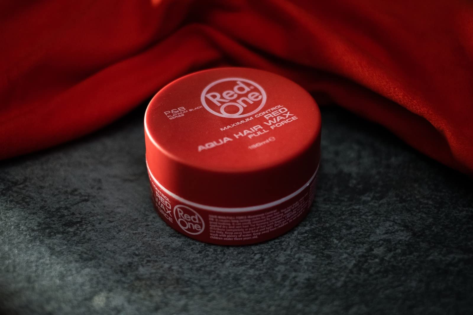 Water based RedOne hair gel wax showing high shine texture.