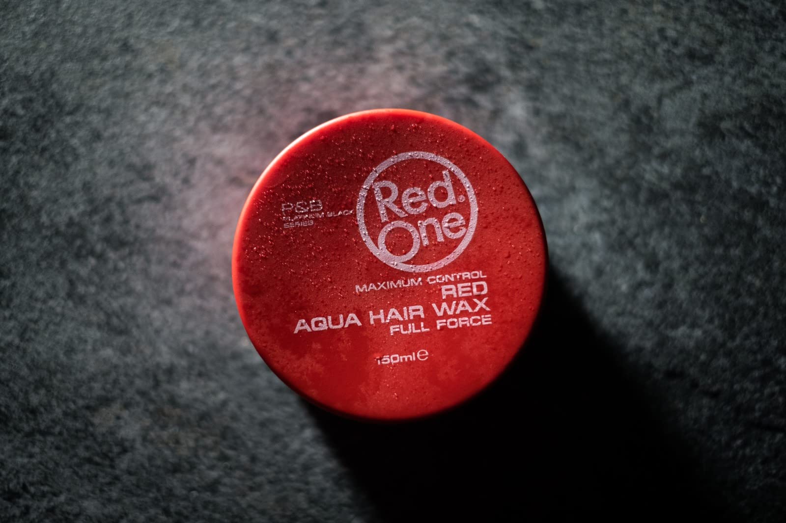 Authentic RedOne Platinum Black Series strawberry scented wax for edge control.