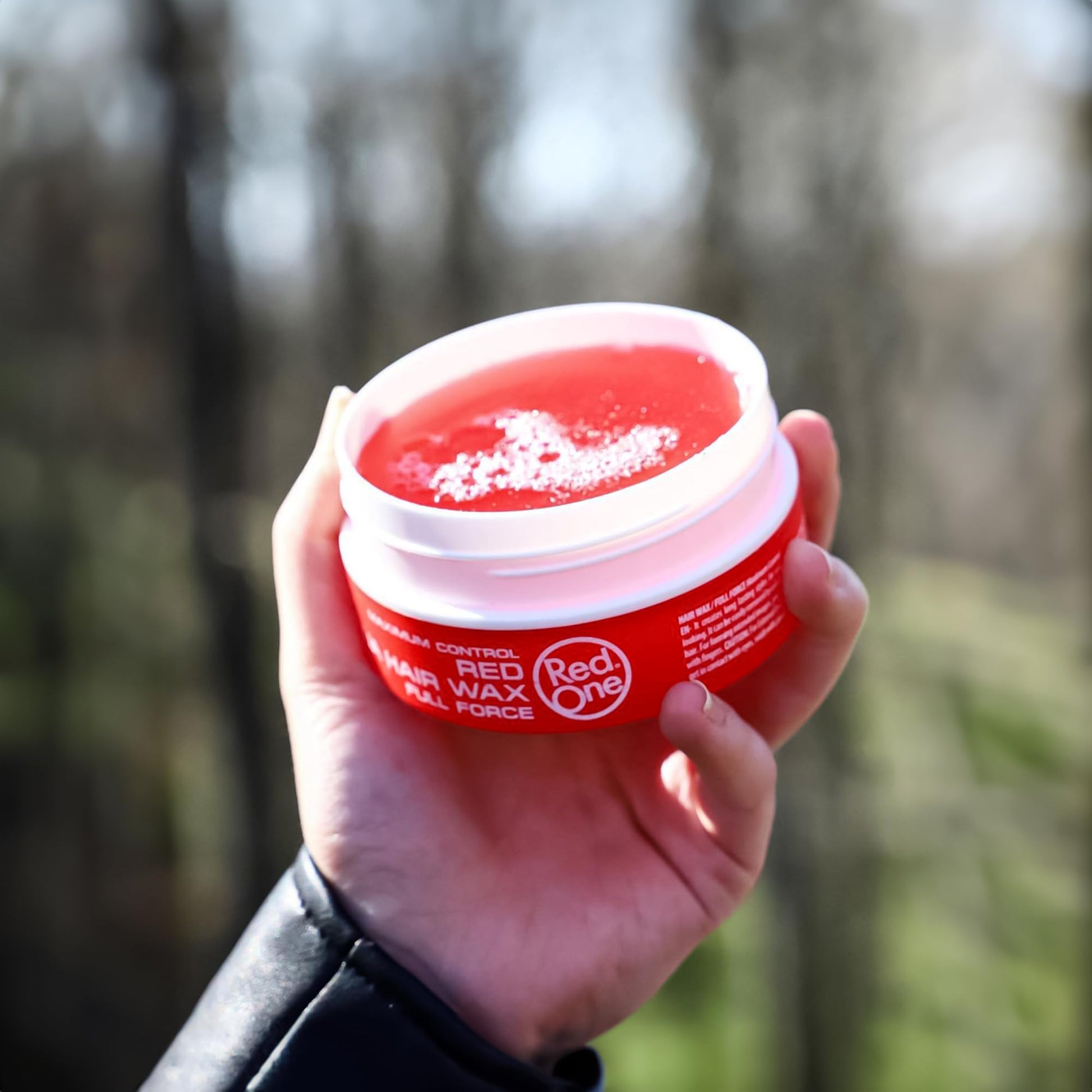Professional grade RedOne red wax for men and women hair sculpting.