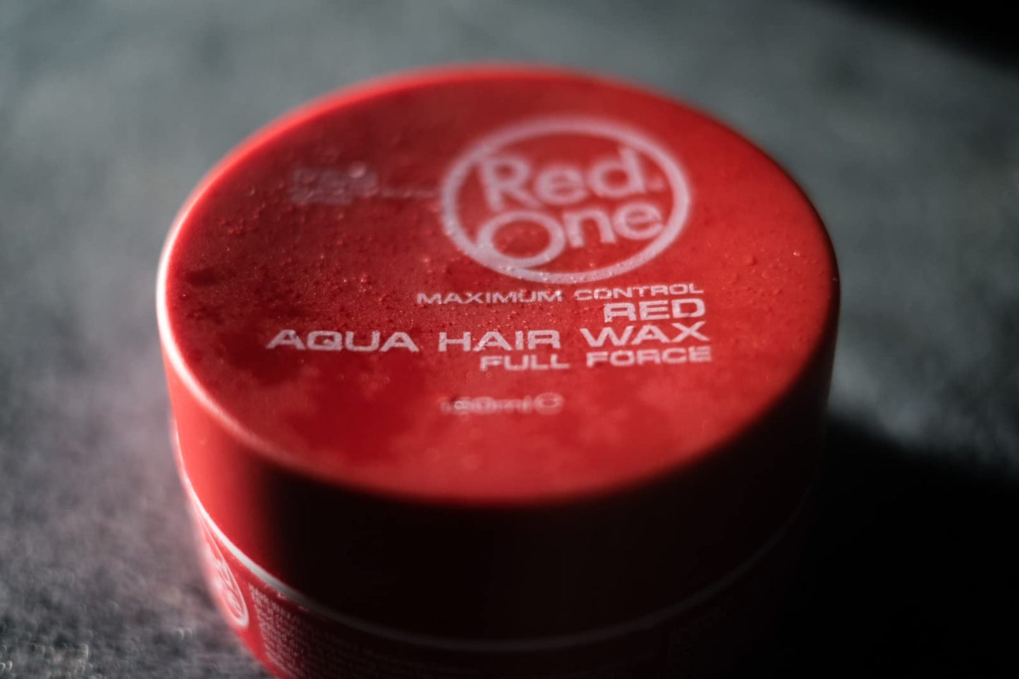 Easy rinse water soluble styling wax by RedOne brand packaging view.