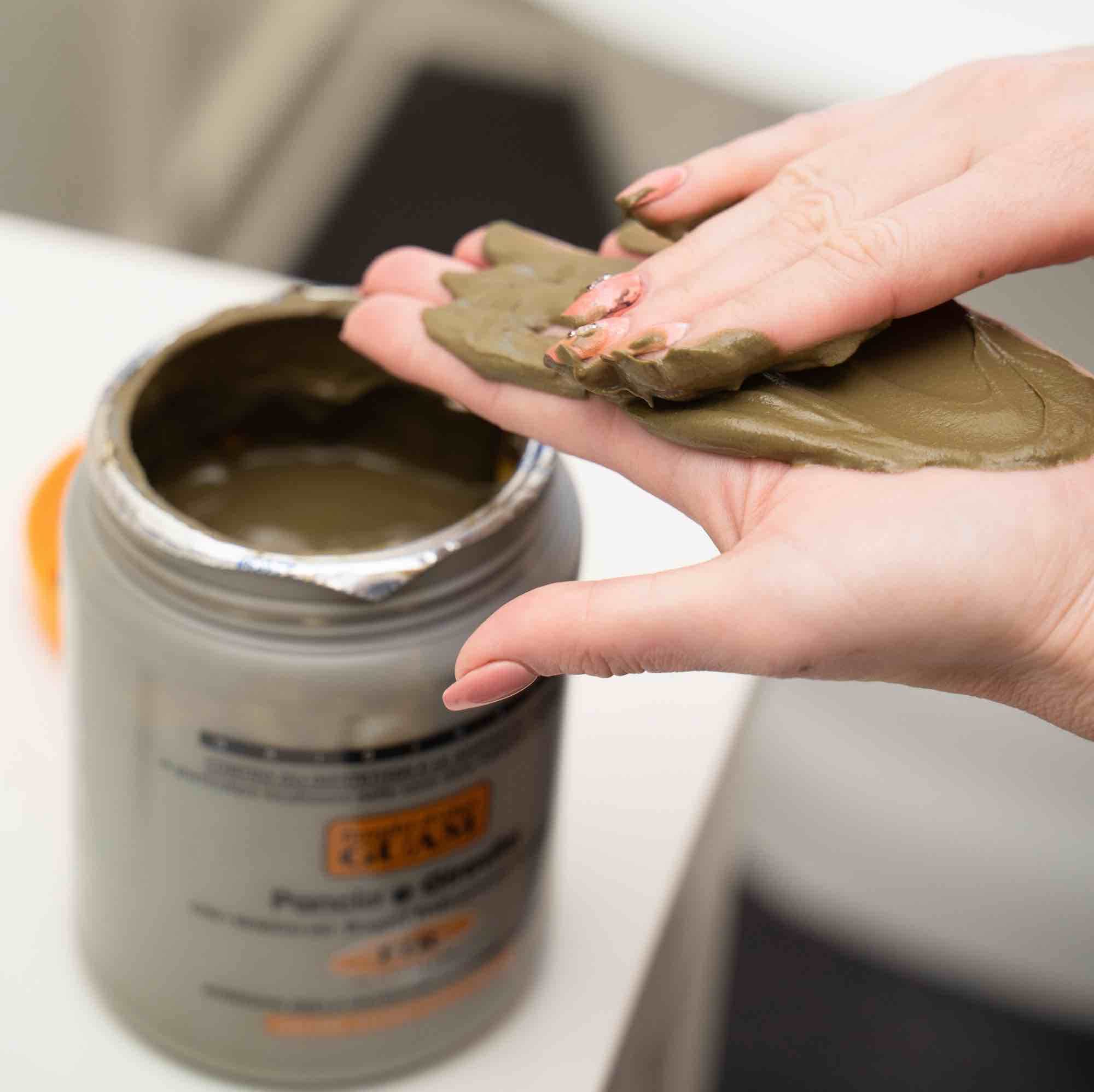 Guam hot mud cellulite treatment container showing authentic marine clay ingredients text.
