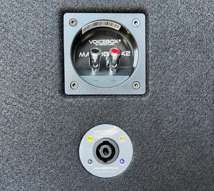 Close up view of the internal prewired four point seven microfarad capacitors inside the empty horn box