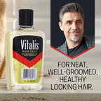Vitalis men's hair tonic clear bottle with black cap on red and yellow background