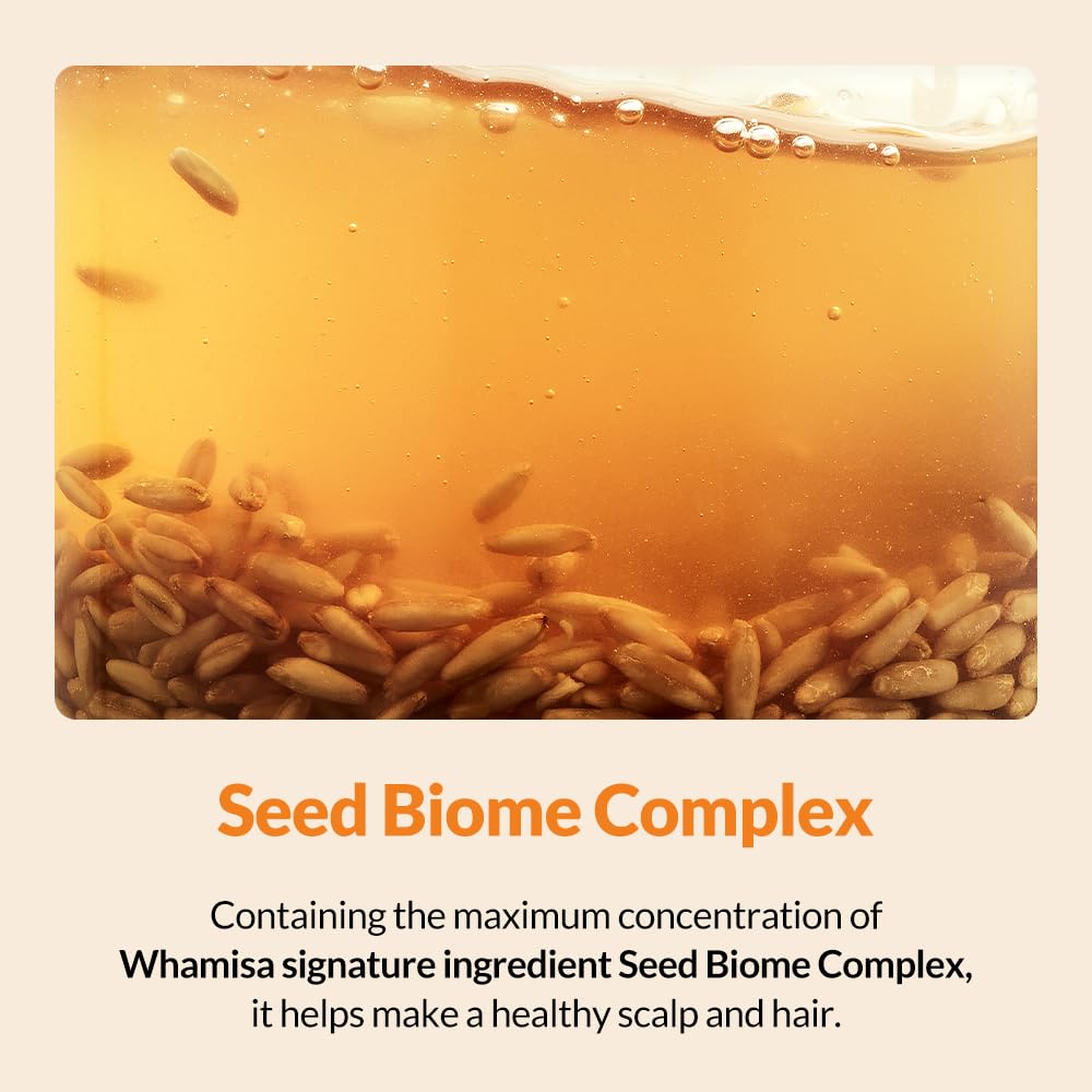 Side view of Whamisa Seed Biome Complex scalp treatment bottle showing clear liquid formula for dry and itchy scalps.