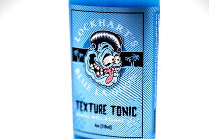 Lockhart's Blue LaGoon grooming spray bottle displaying the high performance texture styling liquid