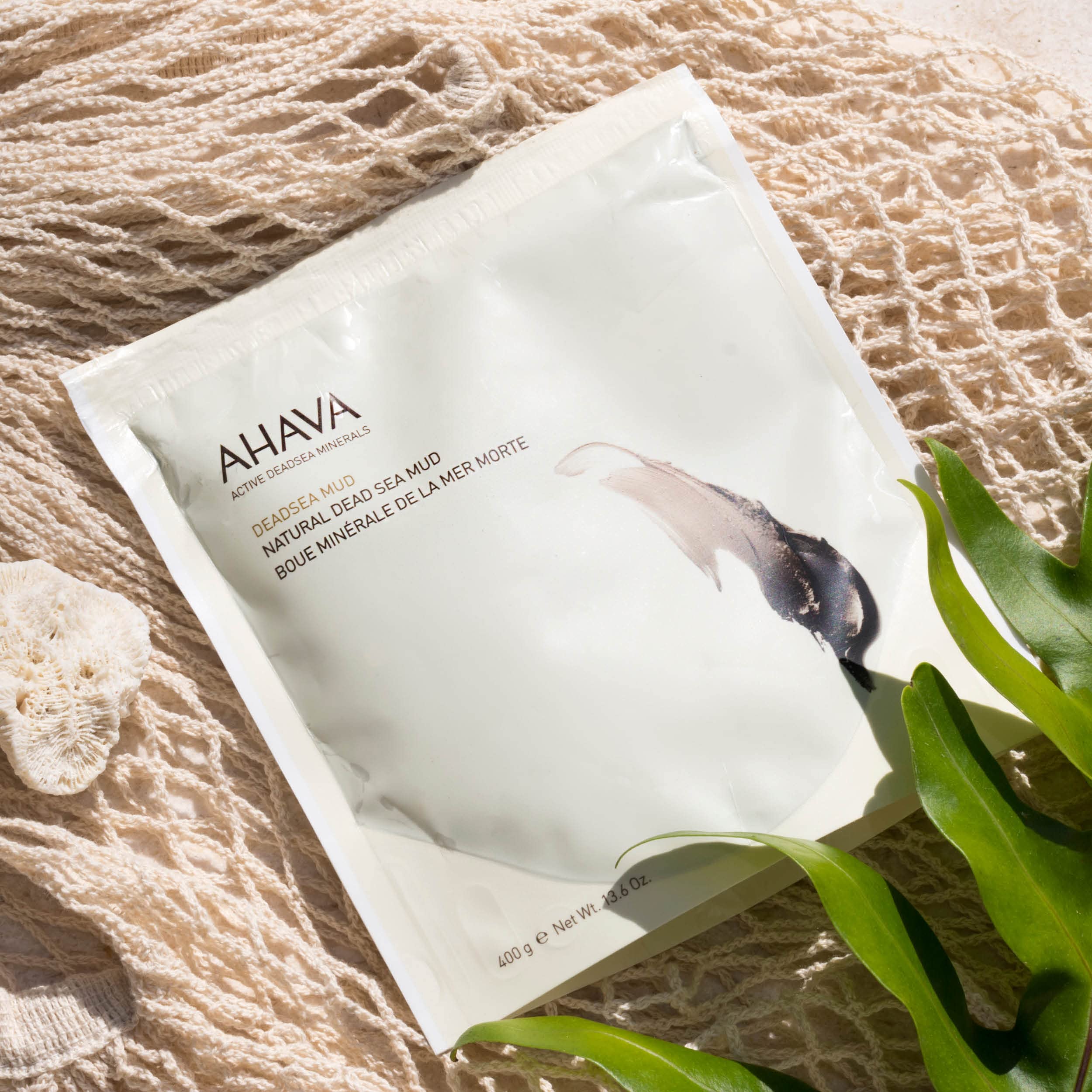 Back view of AHAVA Dead Sea Mud packaging with ingredient details and usage instructions.
