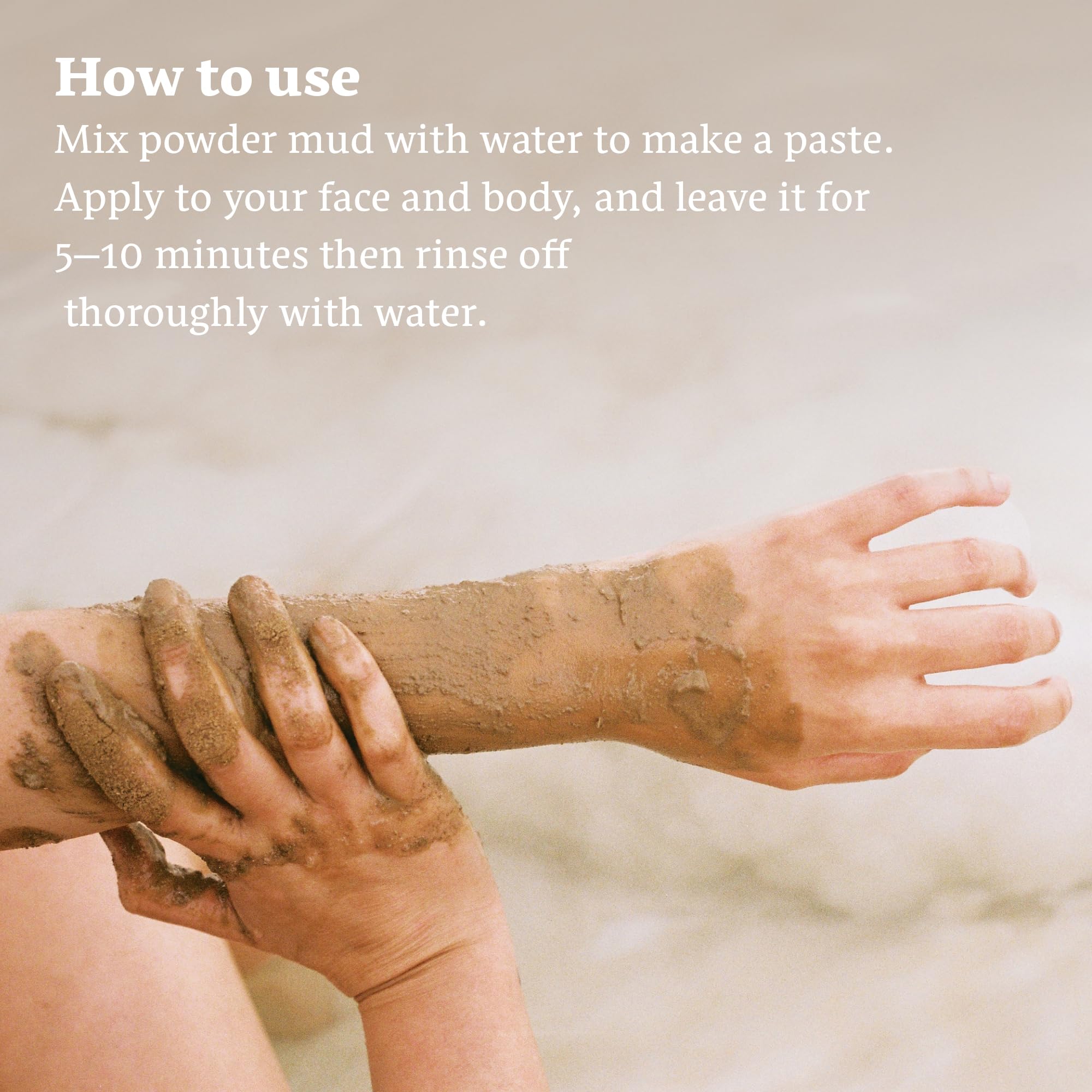 Applying Numeira Dead Sea Mud Mask for deep cleansing