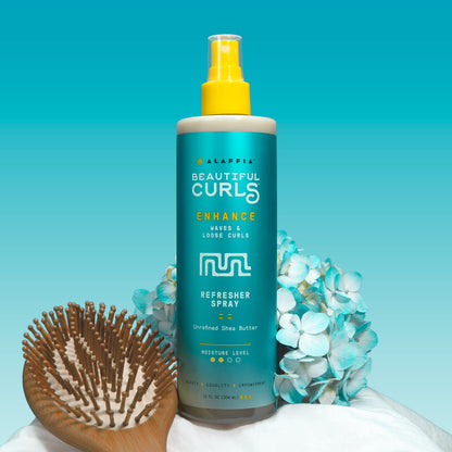 Authentic Alaffia Beautiful Curls spray bottle demonstrating the pump nozzle designed for even mist distribution.