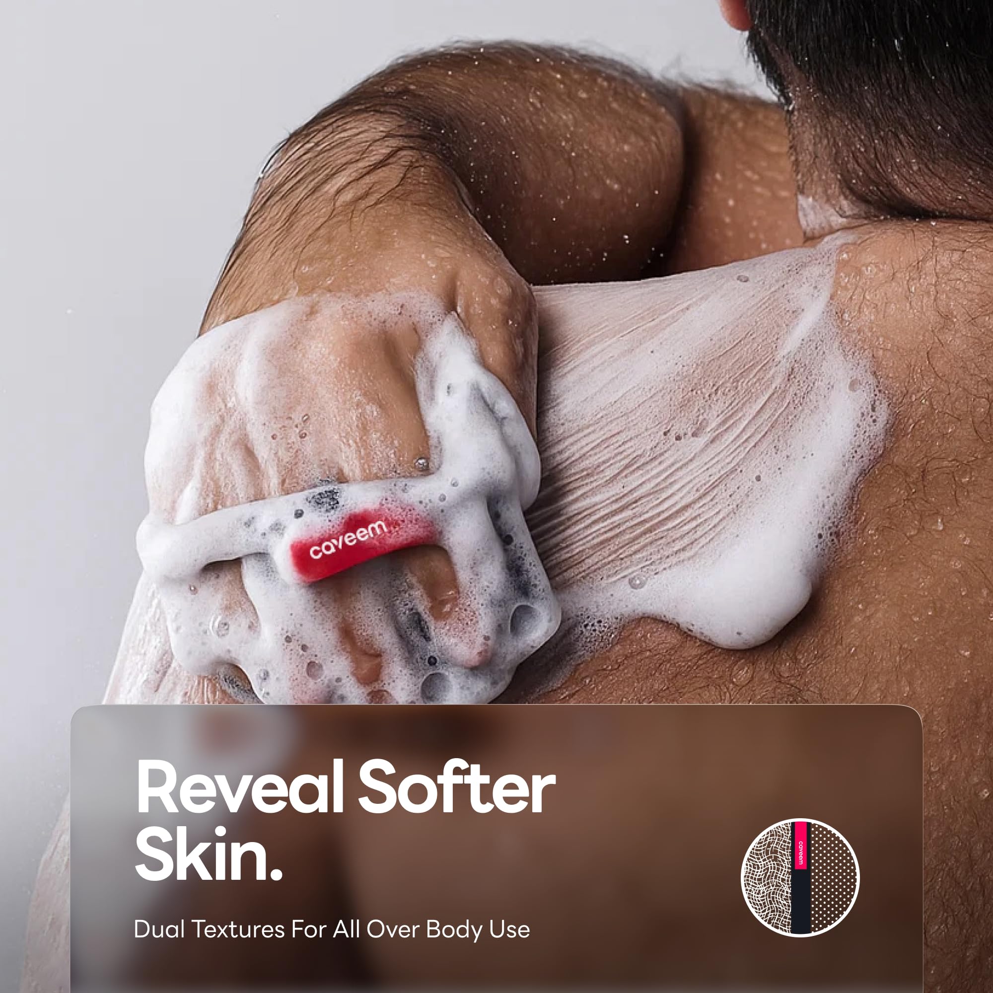 Caveem bath and body scrub buffer 2 pack in dark grey displaying the integrated hand strap for grip.