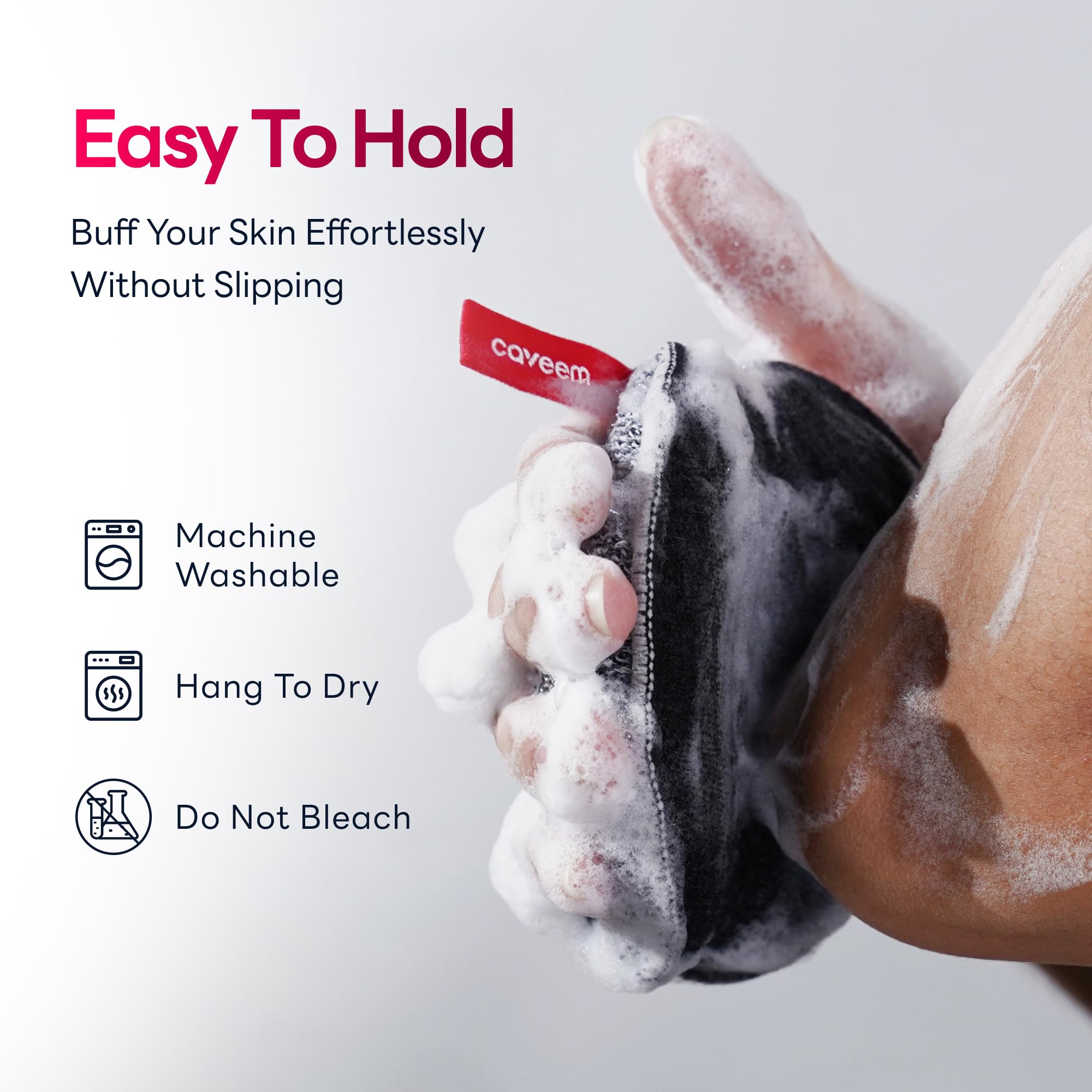 Caveem shower sponge hanging by its storage loop to demonstrate the quick drying design.