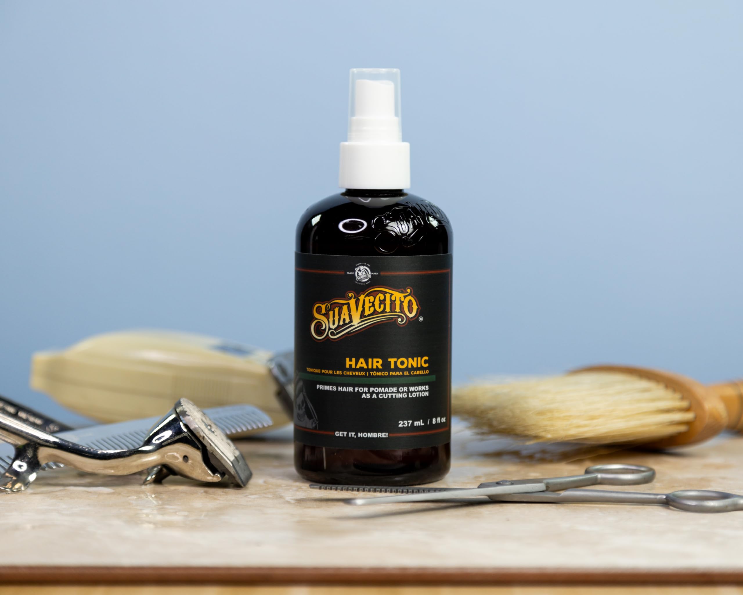 Suavecito alcohol free hair tonic spray being used as a pre styler