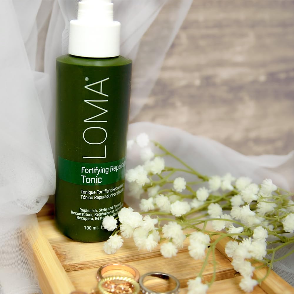 Loma professional hair care repairative tonic packaging details and organic ingredients list.