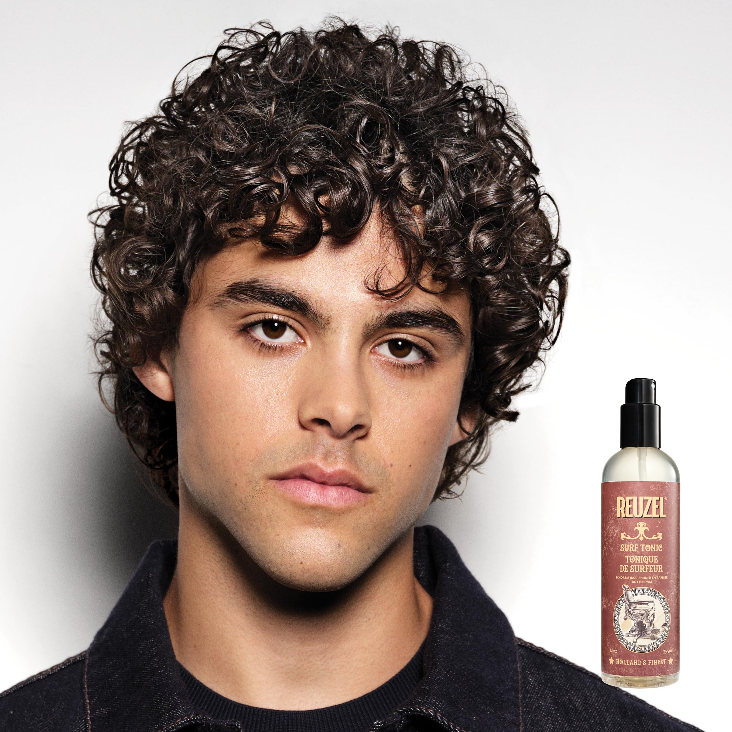 Reuzel Surf Tonic fragrance free sea salt spray showing the product labeling and pump applicator