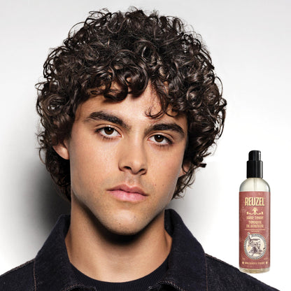 Reuzel Surf Tonic fragrance free sea salt spray showing the product labeling and pump applicator
