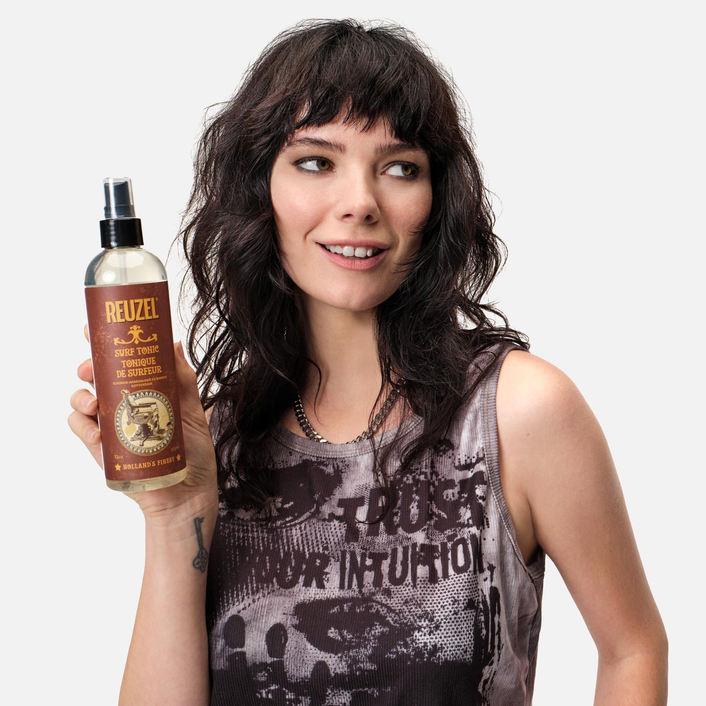Back label of Reuzel Surf Tonic hairspray detailing the usage directions and full ingredients list