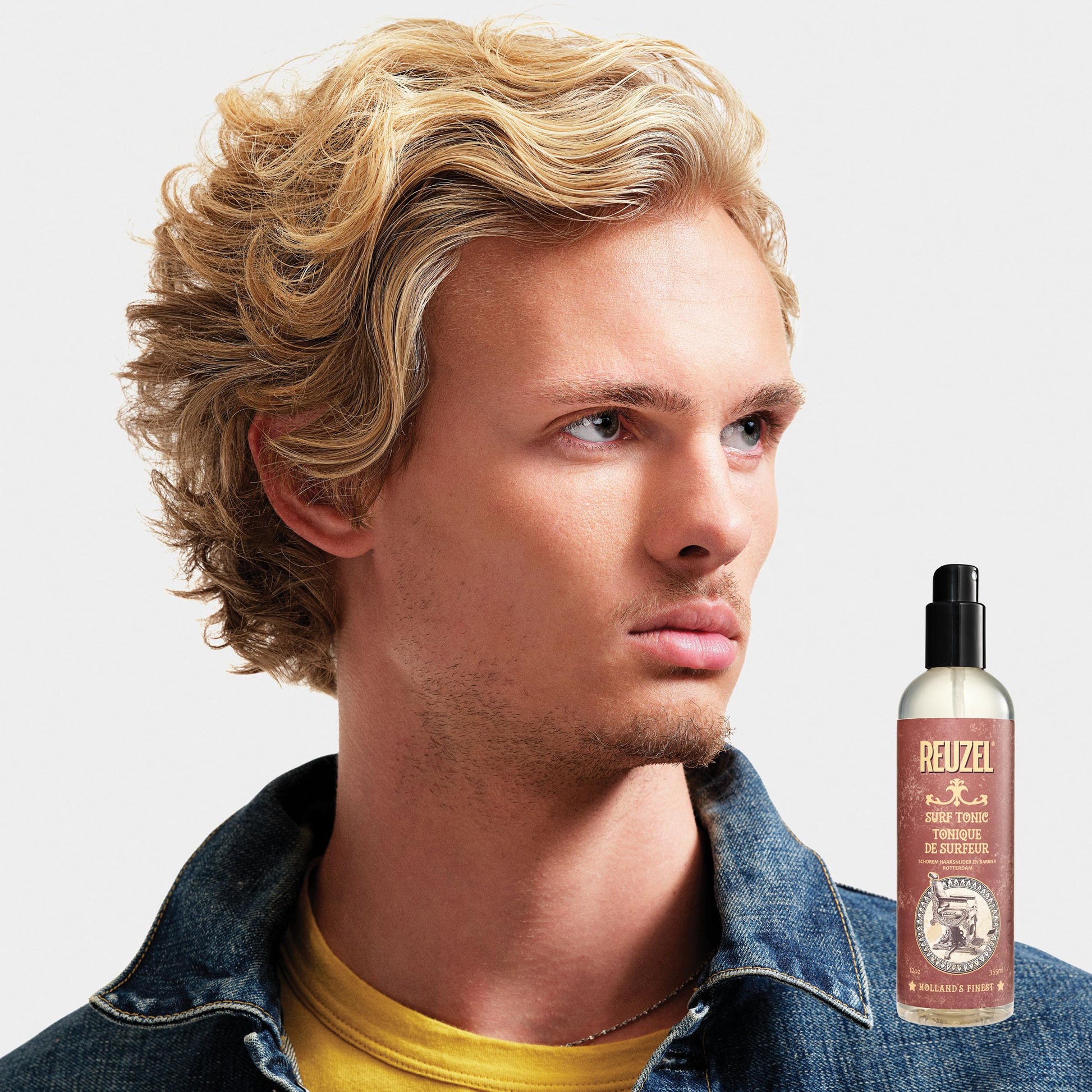 Reuzel Surf Tonic fragrance free hairspray showcasing the authentic barbershop style bottle design