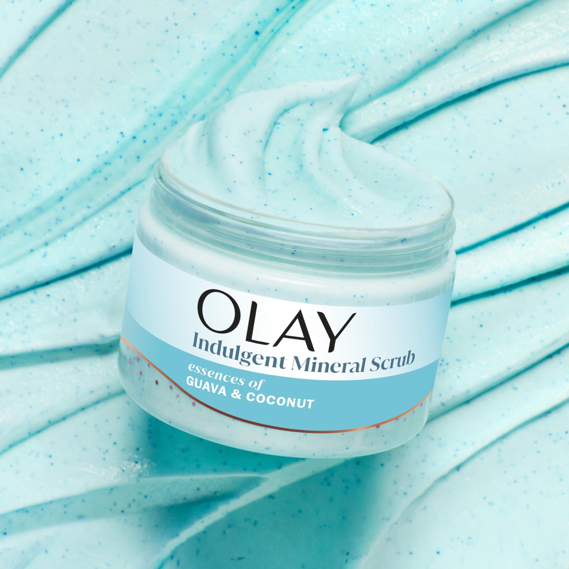 Olay Indulgent Mineral Scrub container highlighting the skin renewing formula.