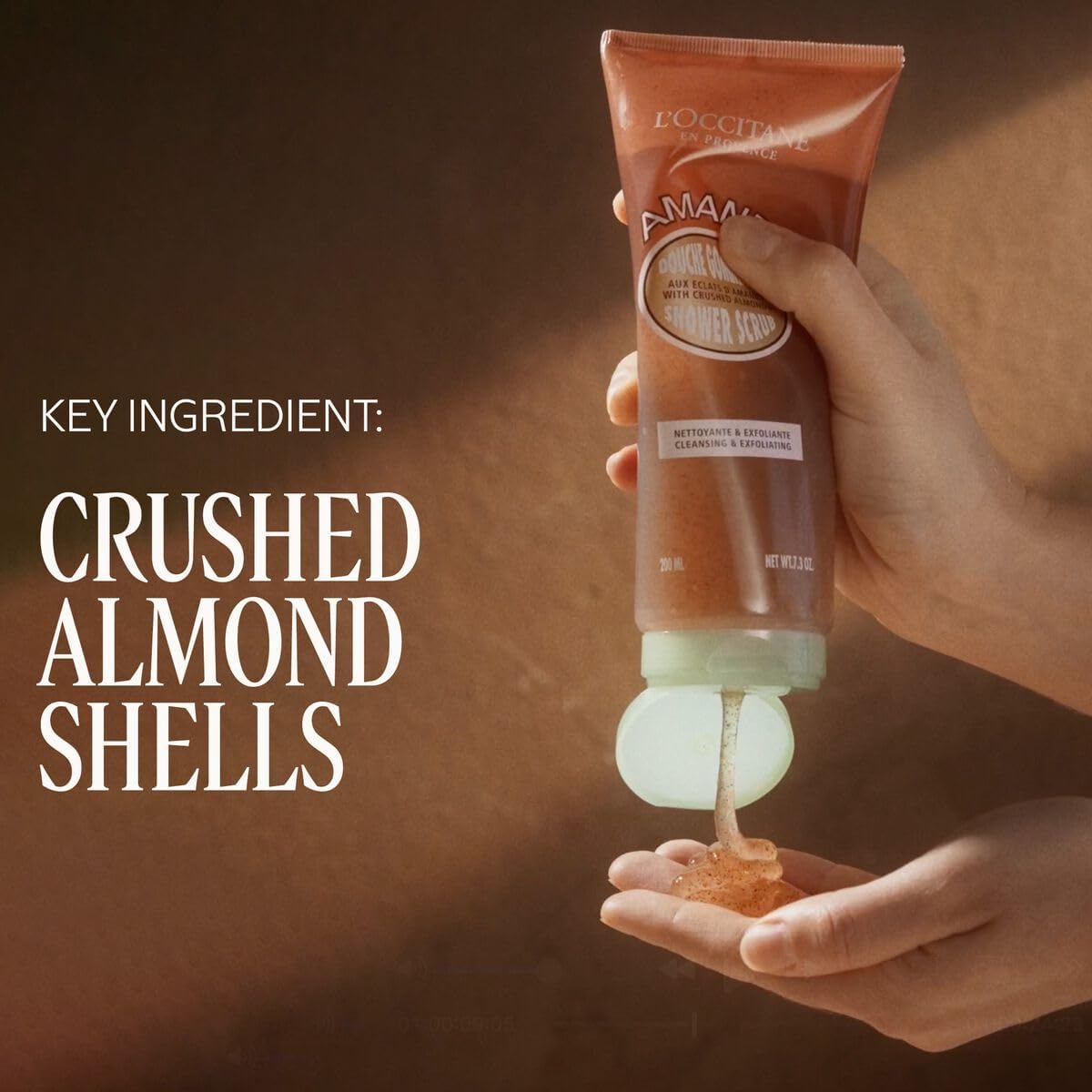 L'Occitane Almond Shower Scrub texture close up showing crushed shells