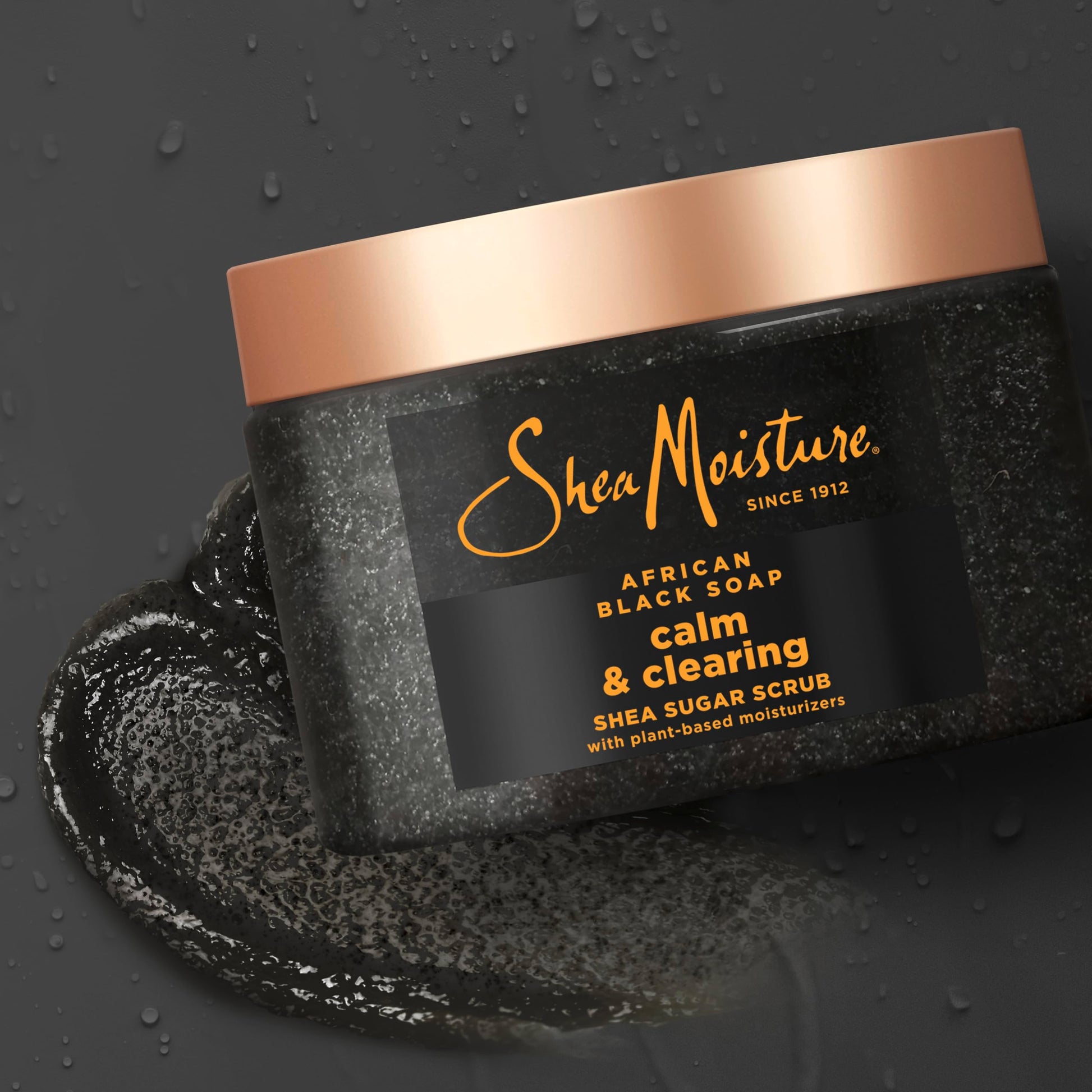 Back label details of SheaMoisture twelve ounce body scrub with ingredients list