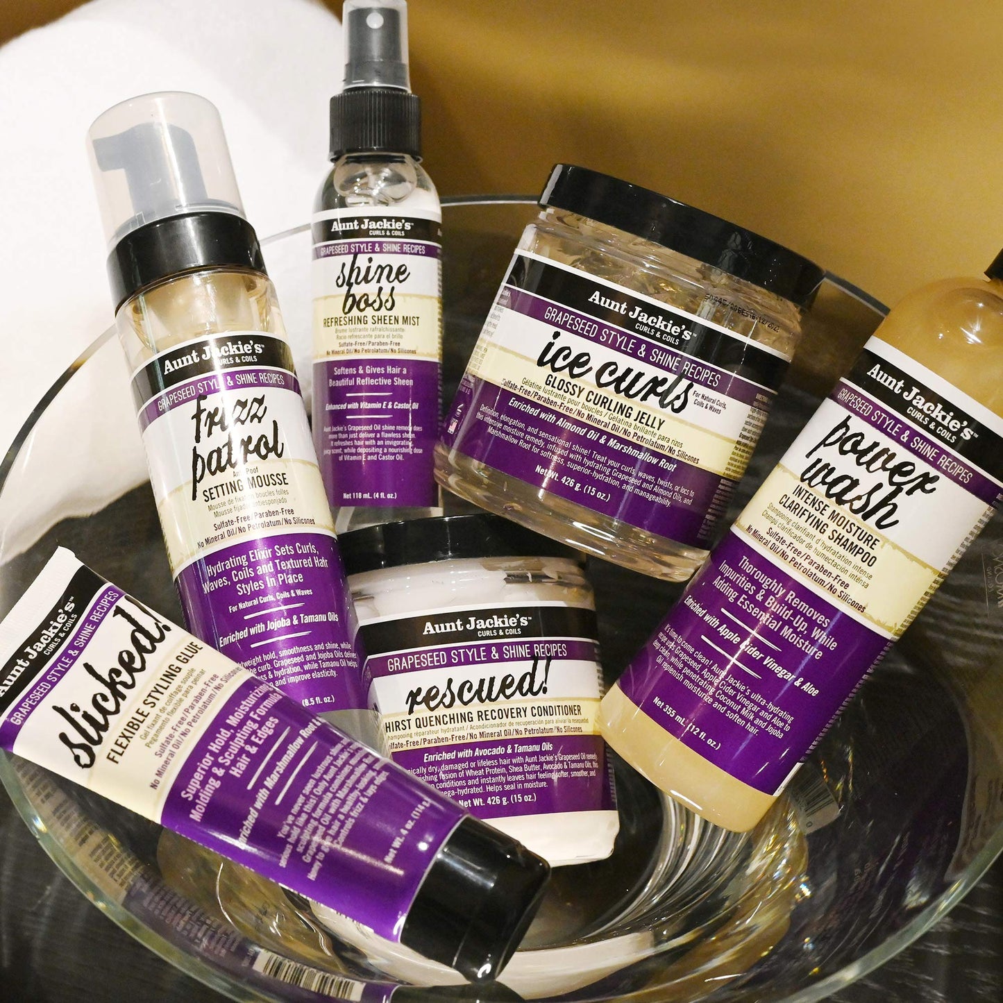 Aunt Jackie's Ice Curls container highlighting marshmallow root and grapeseed oil benefits