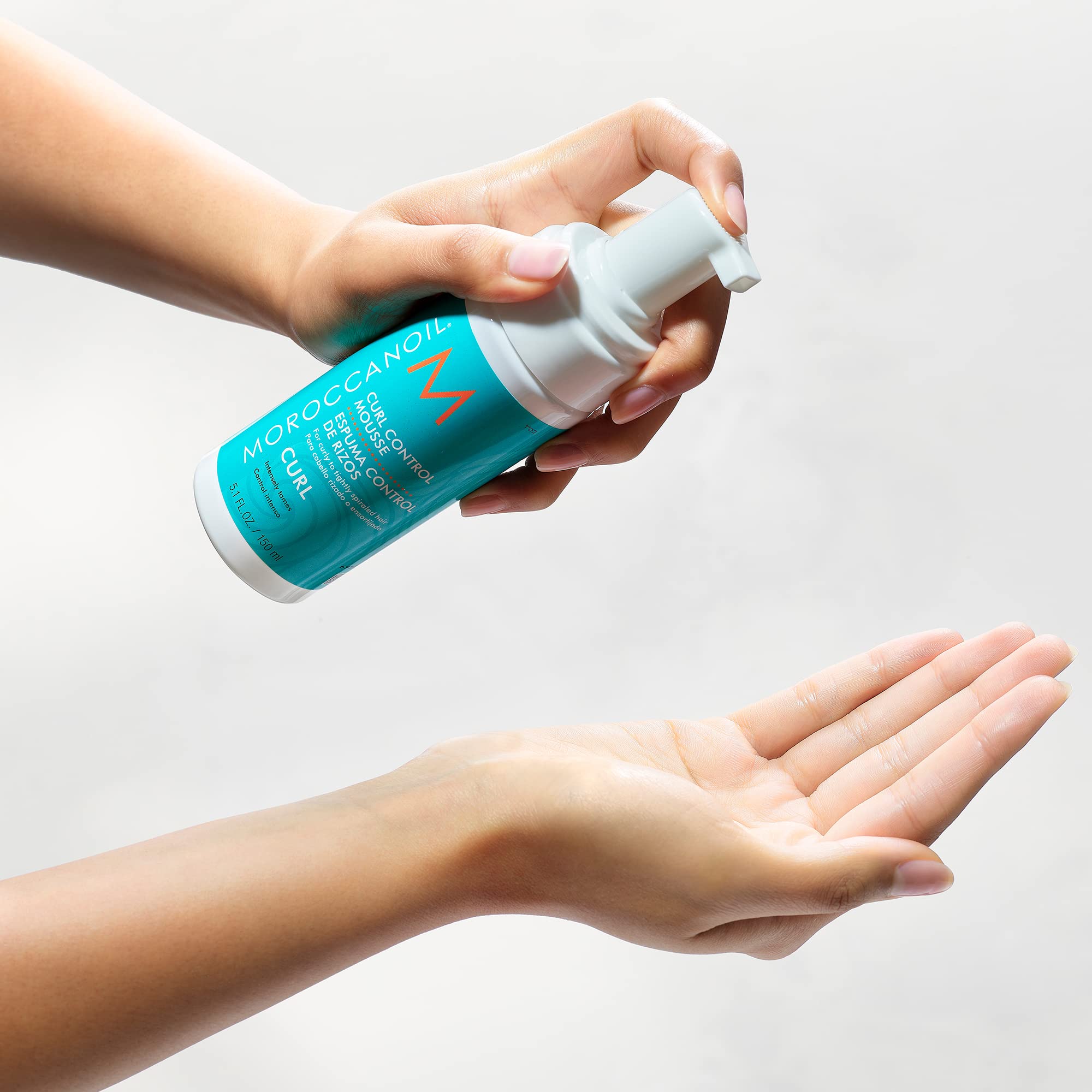 Authentic Moroccanoil lightweight styling foam for curly and coily hair textures