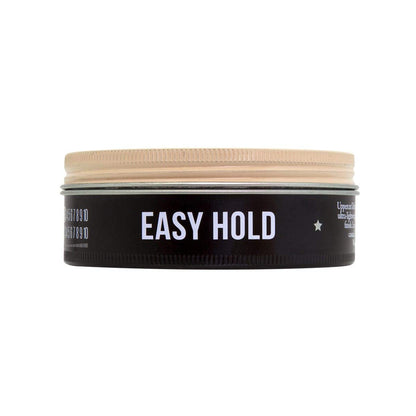 Open tin of Uppercut Deluxe weightless easy hold cream pomade showing formula