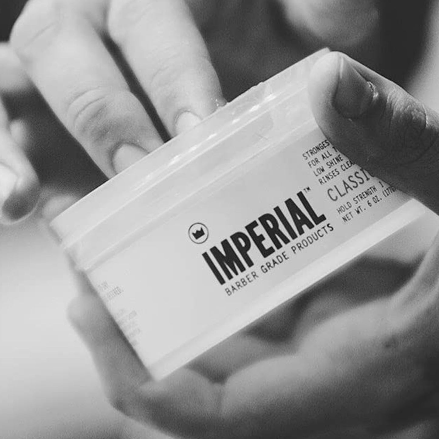 Imperial Barber Classic Pomade 6 Ounce showing the smooth gel pomade consistency inside the tub.