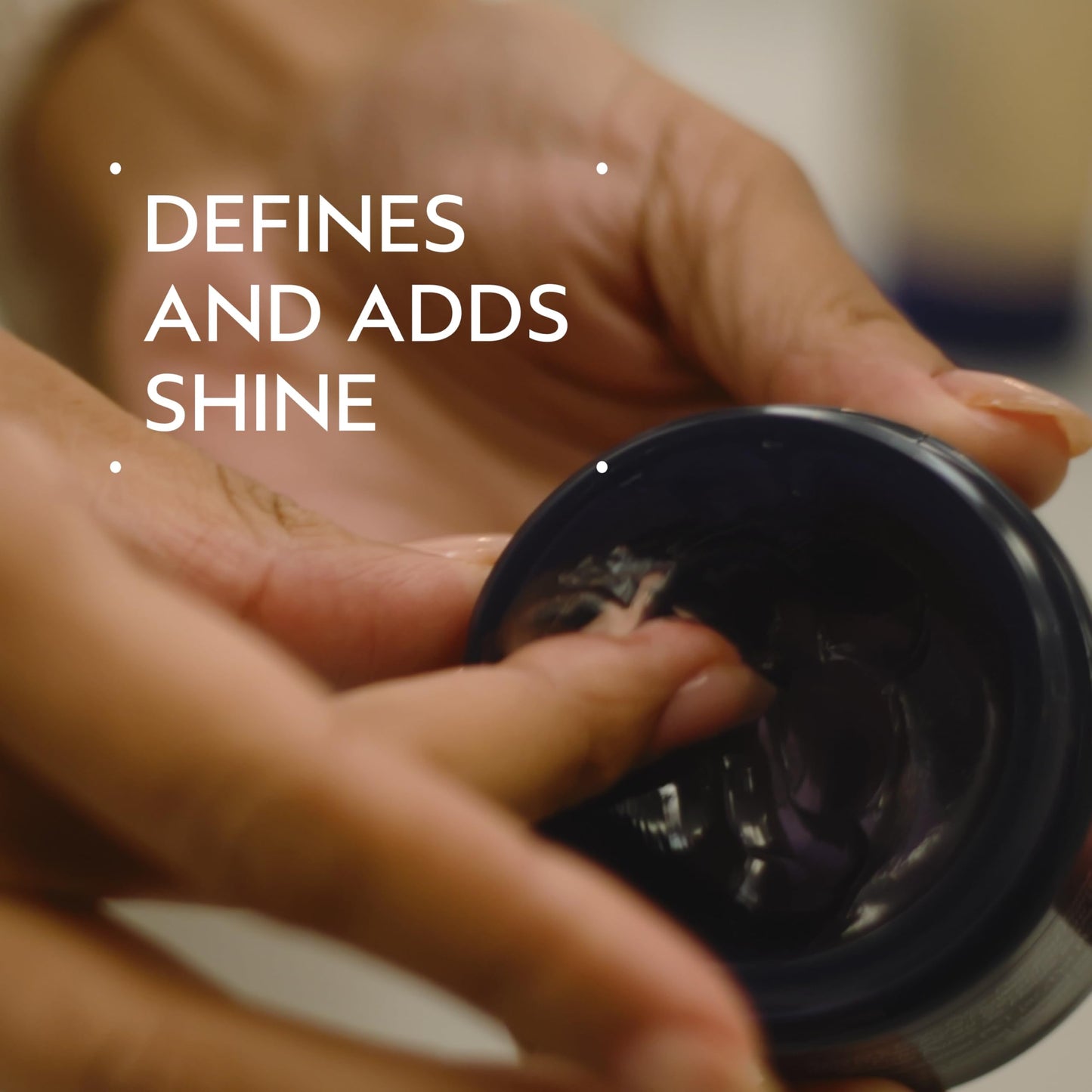Aveda Brilliant Humectant styling paste open jar showing product texture