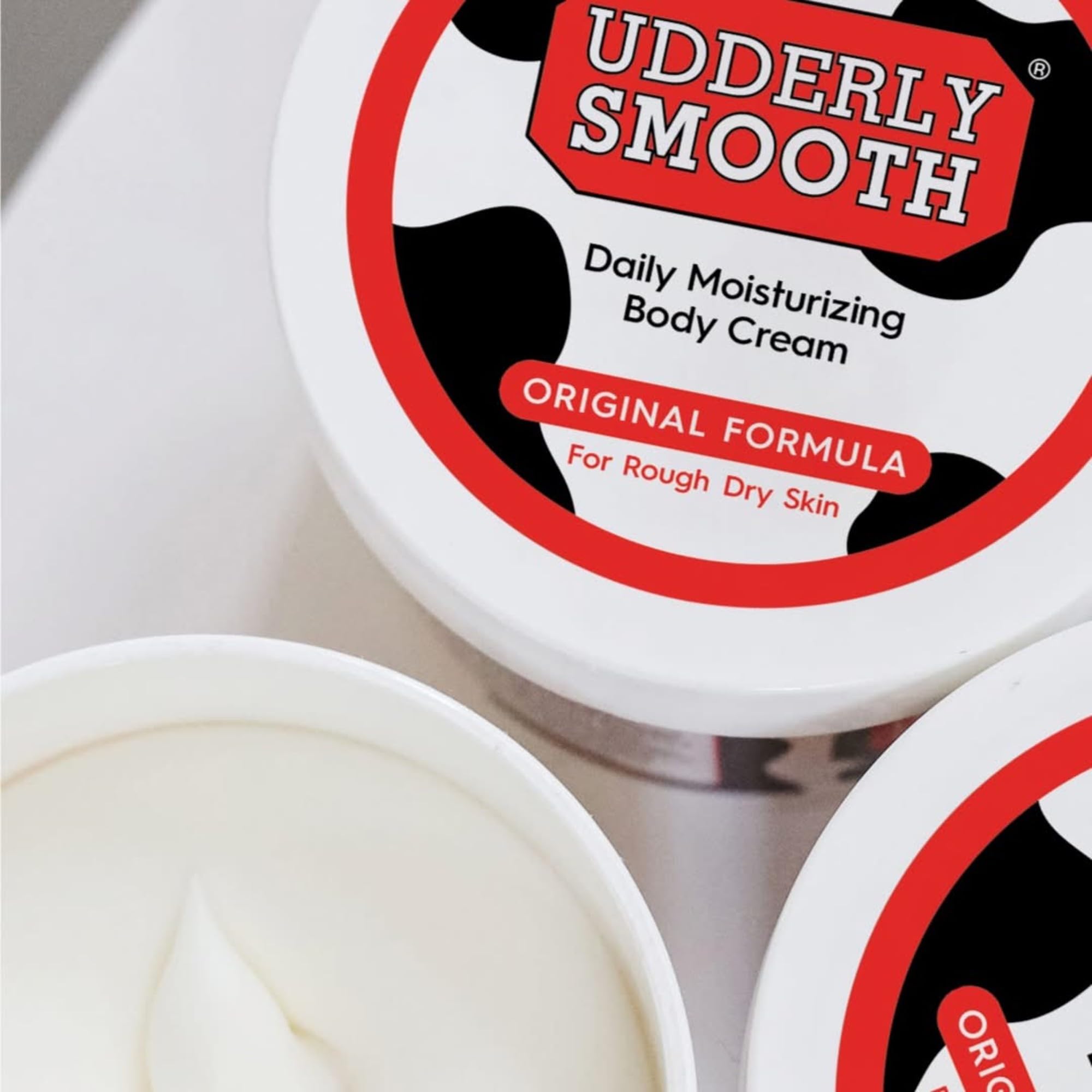 Udderly Smooth moisturizer bundle displaying the original water based formula ingredients list and manufacturing details