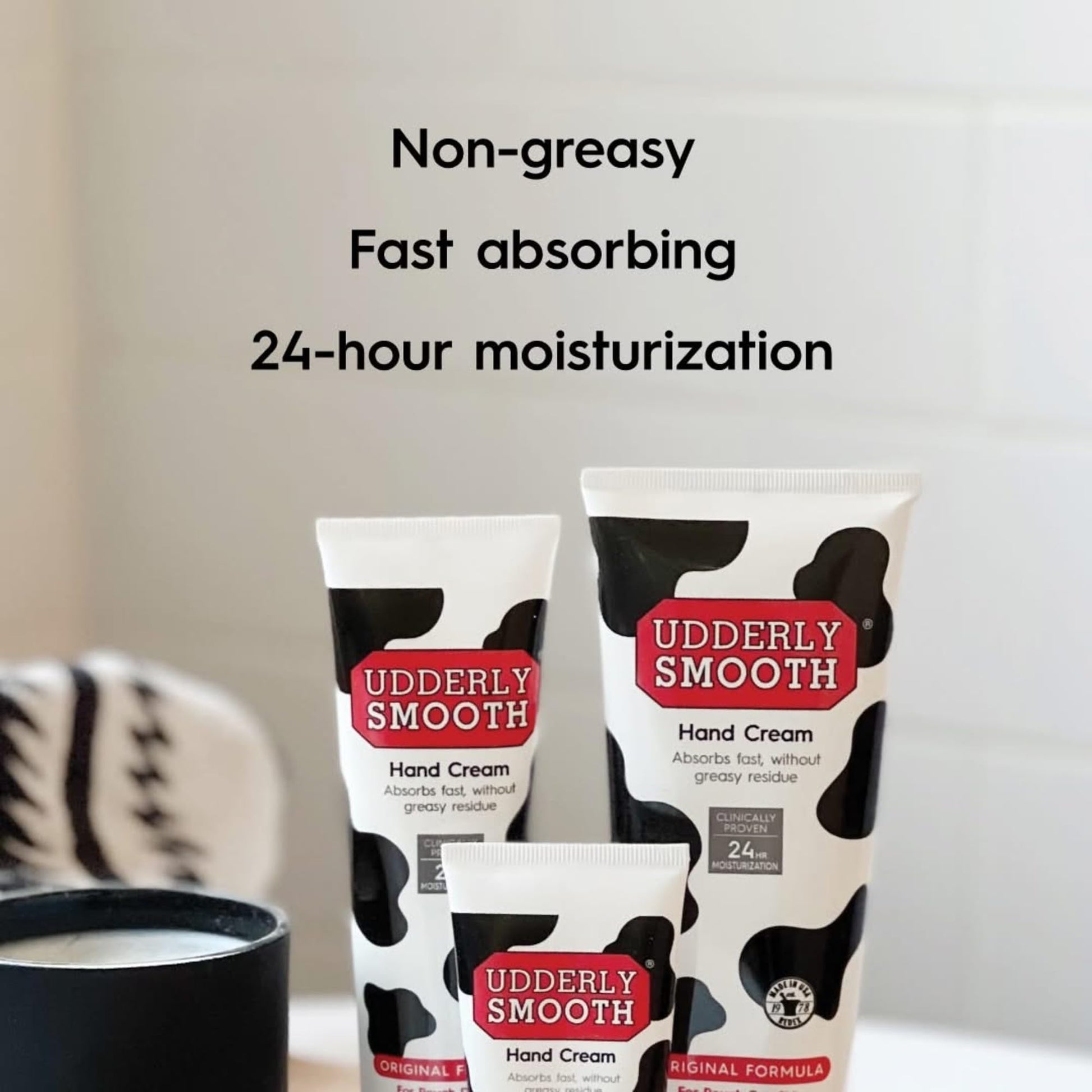 Udderly Smooth body cream jar and tubes arranged neatly to demonstrate the complete three count skincare kit