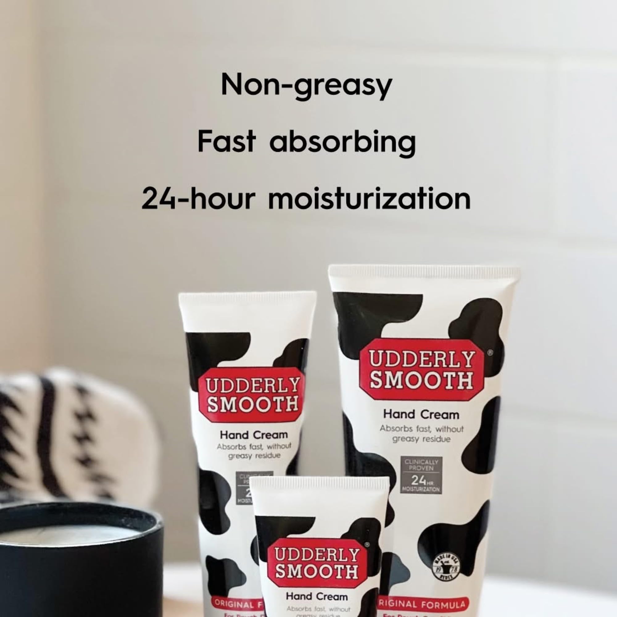 Udderly Smooth body cream jar and tubes arranged neatly to demonstrate the complete three count skincare kit