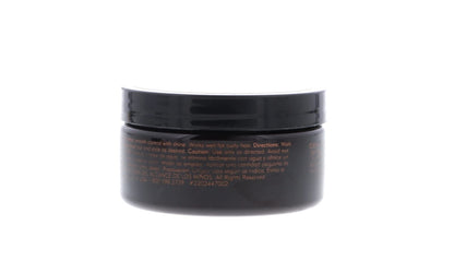 Side view of American Crew hair pomade container detailing the original imported grooming formula