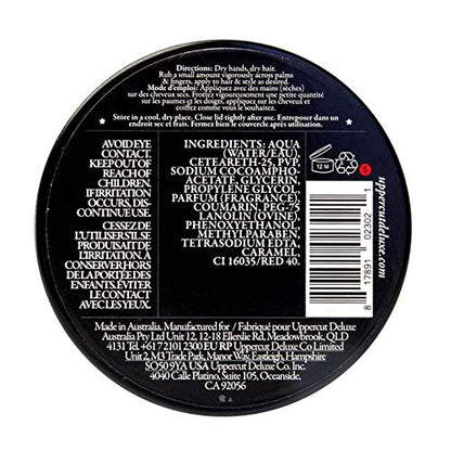 Open tin of Uppercut Deluxe Pomade highlighting the smooth water-soluble styling paste texture.