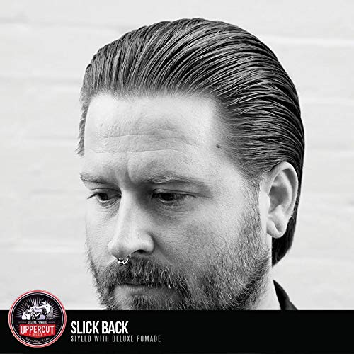 Authentic Uppercut Deluxe professional men's hair grooming product placed on a styling counter.