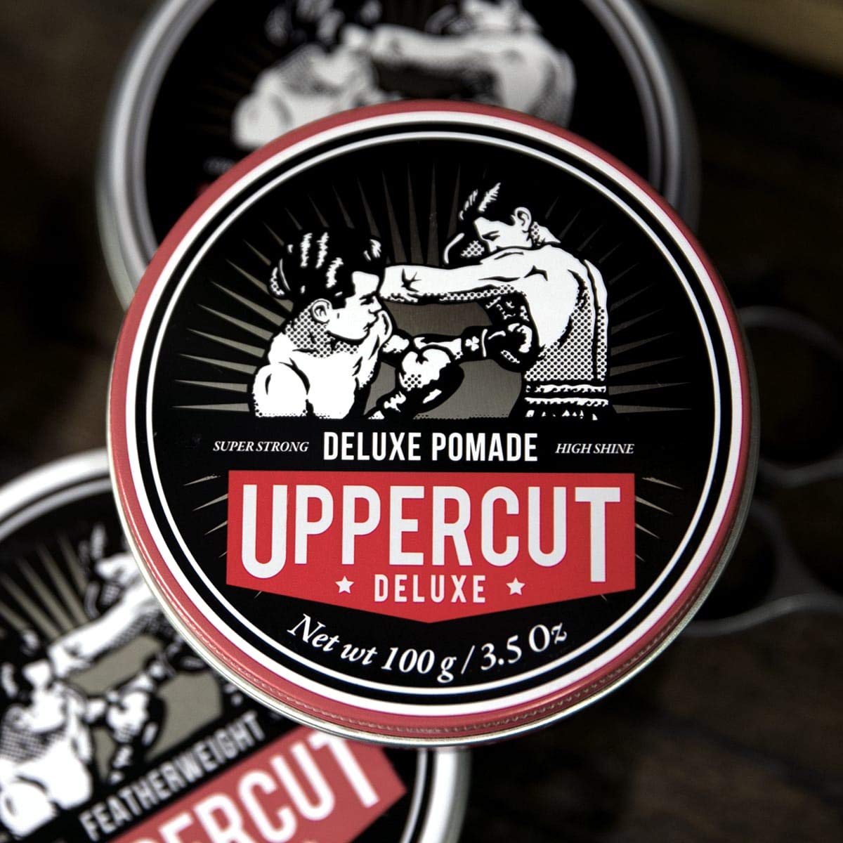 Texture close up of Uppercut Deluxe high shine water soluble hair pomade.