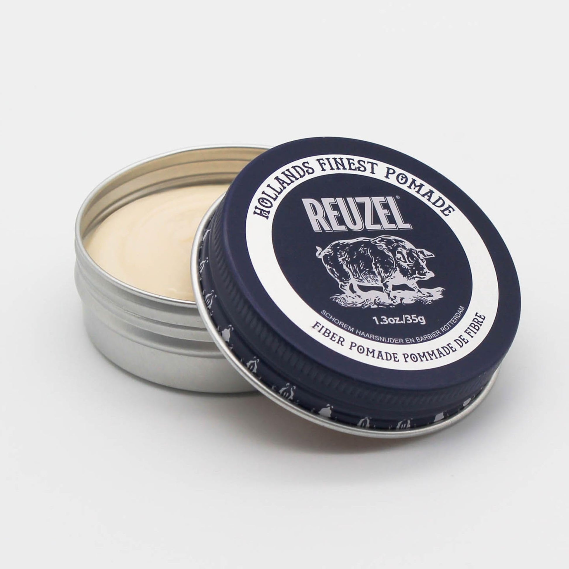 Open container of low shine firm hold water soluble styling wax highlighting the pliable texture.