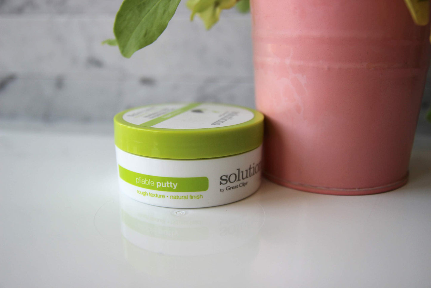 Side view of Great Clips Solutions hair styling putty