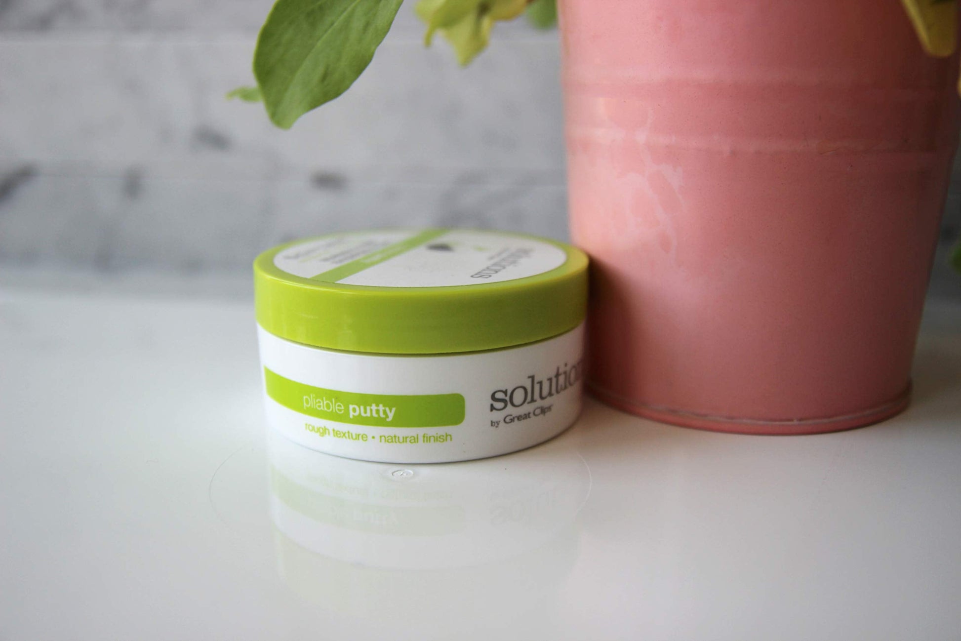 Side view of Great Clips Solutions hair styling putty