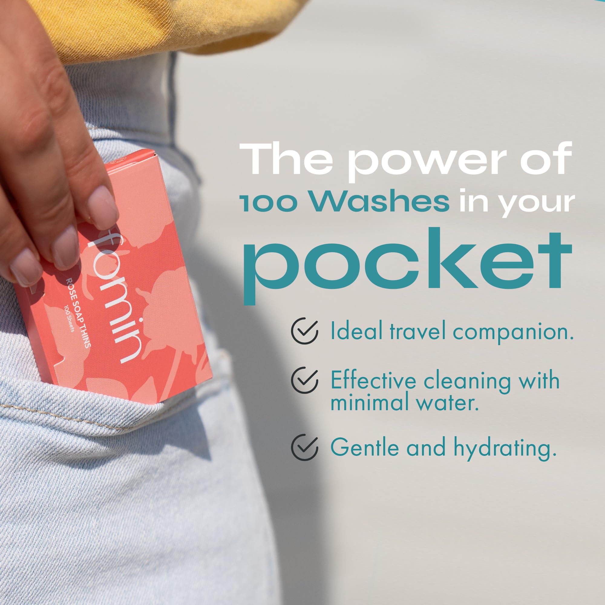A single paper soap sheet dissolving in a wet palm to create instant lather.