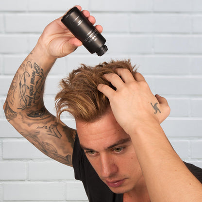 Professional hair styling powder for men on white background