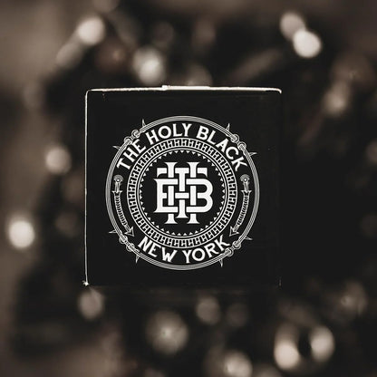 Authentic The Holy Black grooming product branding.