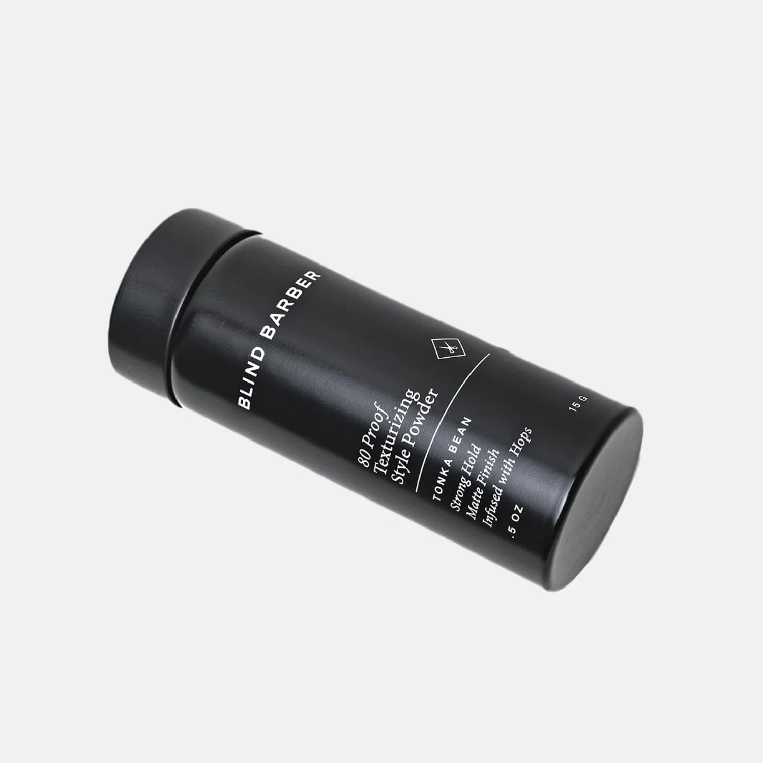 Close up of Blind Barber 80 Proof hair texture powder cap