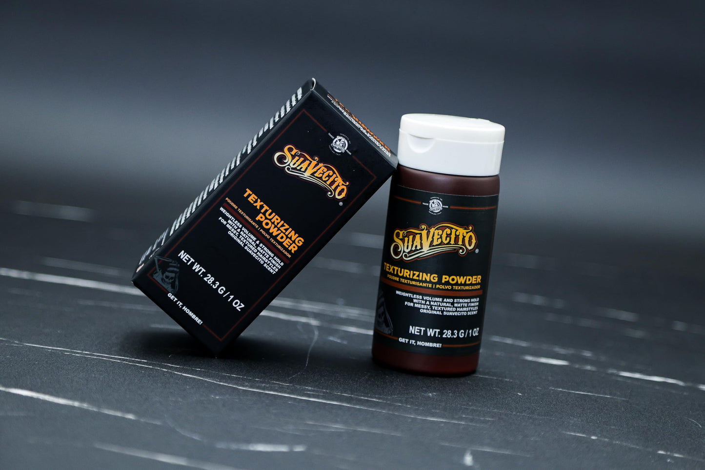 Hand applying Suavecito volumizing powder to hair roots