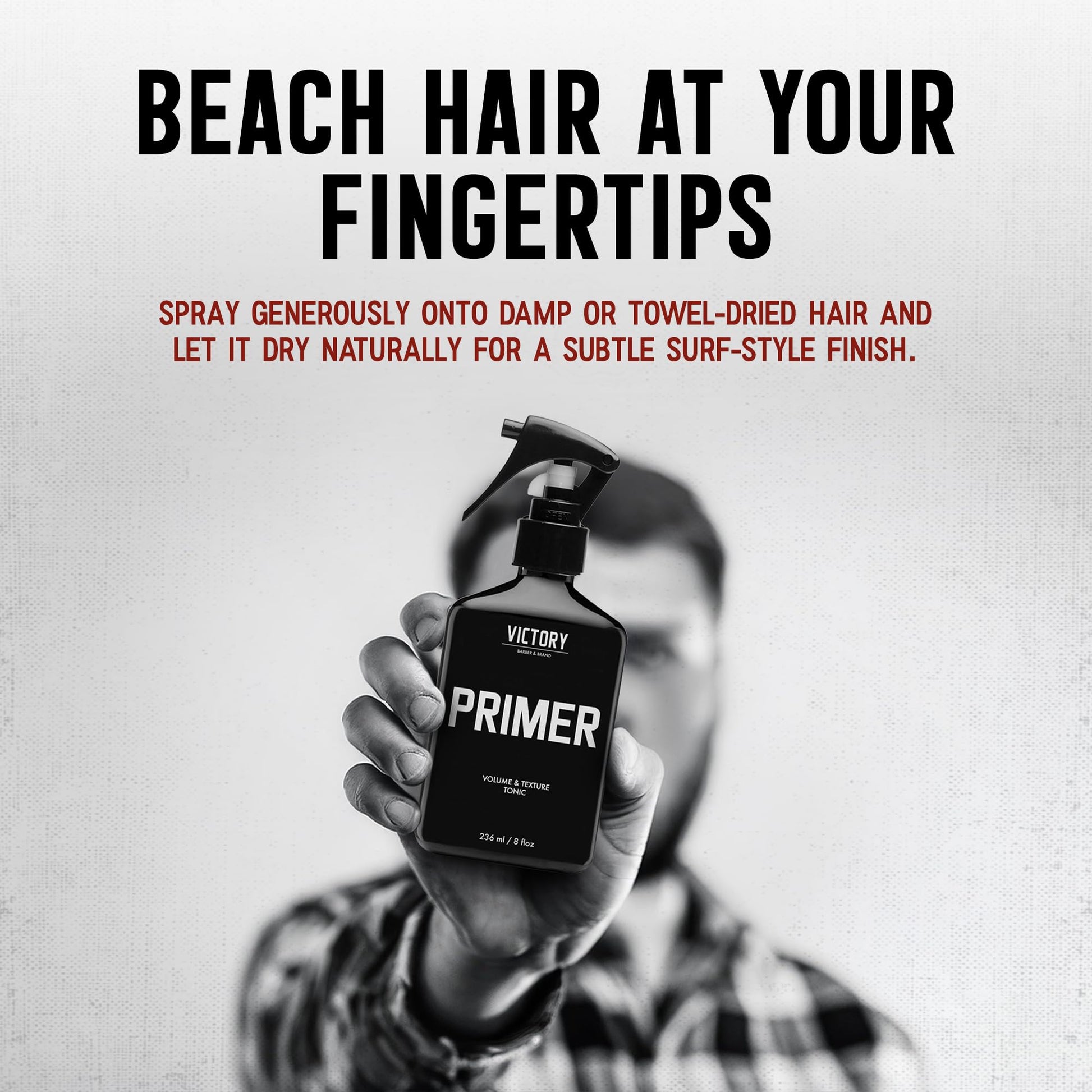 Man applying sea salt thickening spray to damp hair