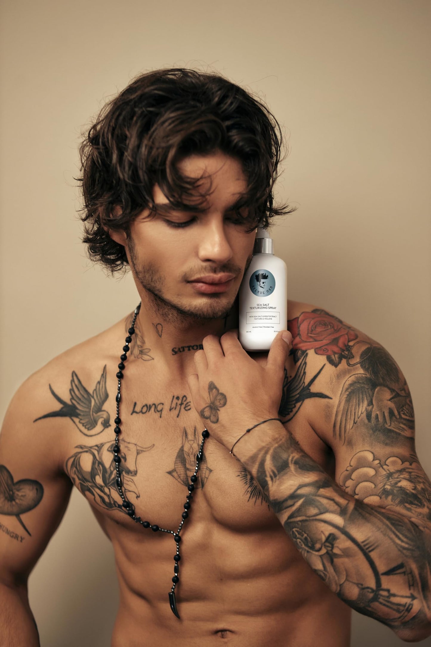 Avenue Man texturizing spray bottle held in hand