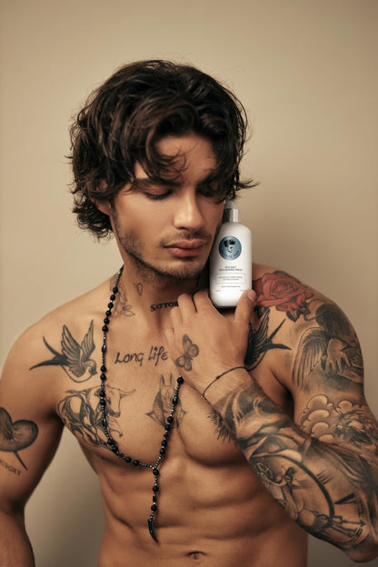 Avenue Man texturizing spray bottle held in hand