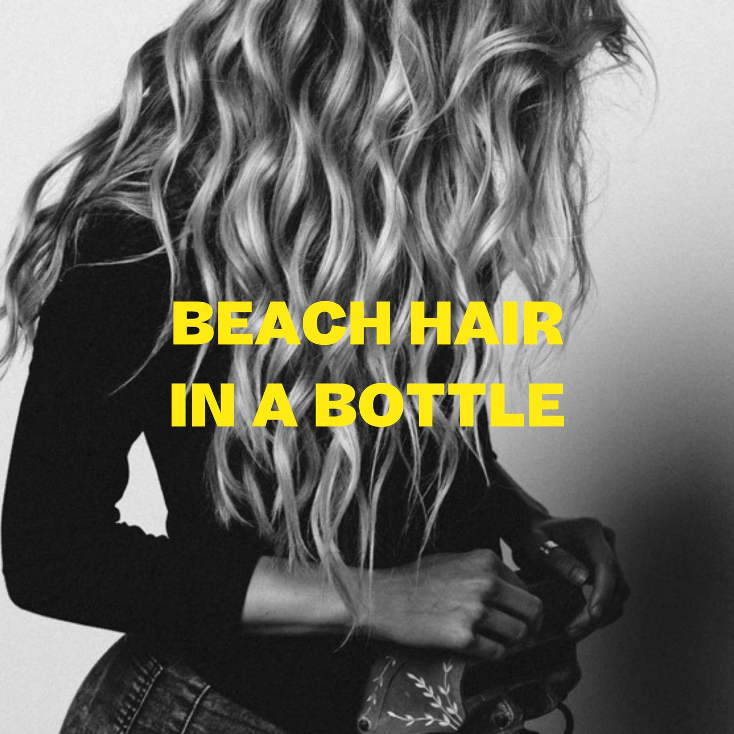Lifestyle shot showing beach wave hair result with Byrd spray